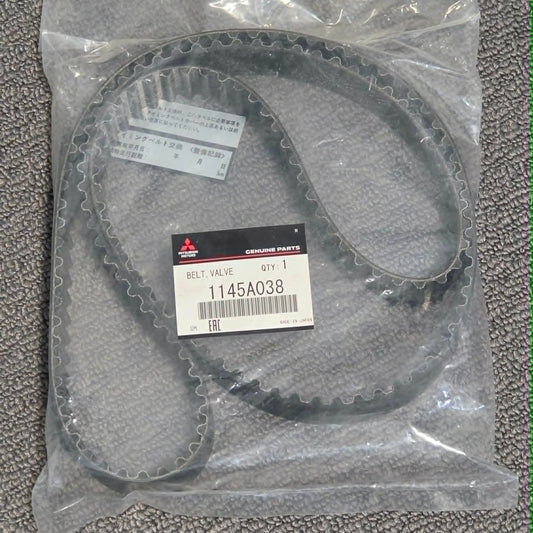 Packaged belt with a label on a textured gray surface